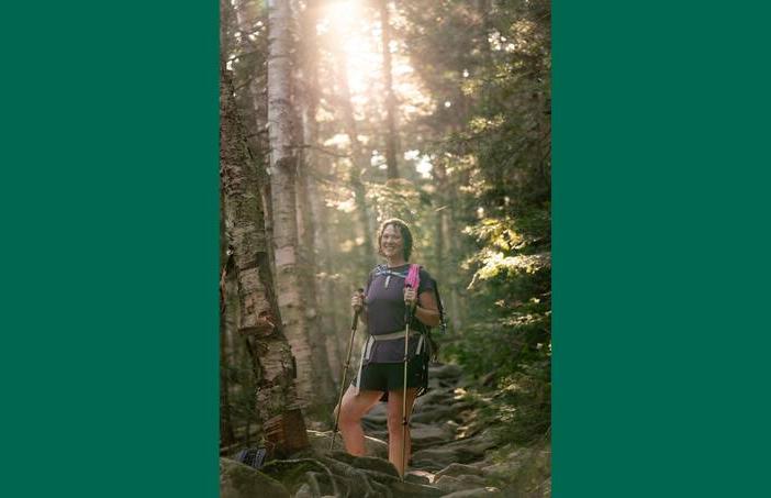 Bariatric surgery patient Krystal Kebler is shown on a hike in the woods.